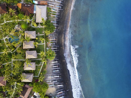 Amed coastline with boats on the beach