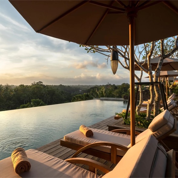 Enjoy life at the infinity pool at Adiwana Bisma overlooking the valley of Ubud's jungle